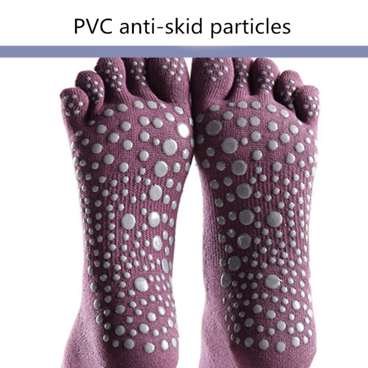 Close-up of wine red five-toe yoga socks with anti-slip dot grip on the foot
