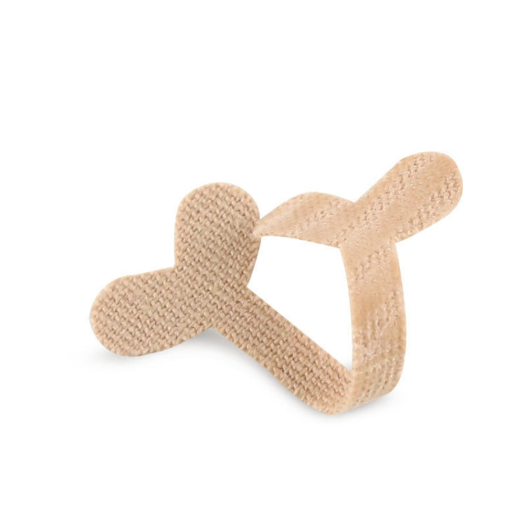 Beige fabric toe nail correction tape strip with bone-shaped adhesive pads