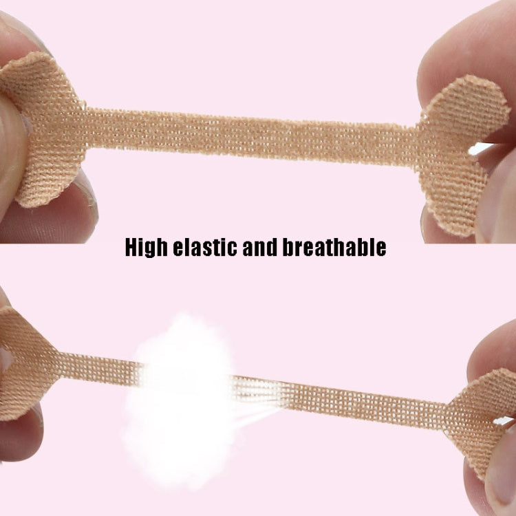 Elastic beige toe correction tape strip held between fingers, showing adhesive ends