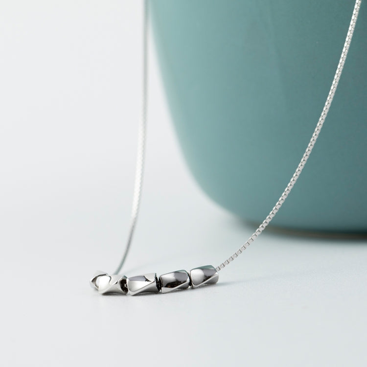Sterling silver necklace with sculpted link charms and curved chain