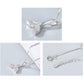 Silver whale-tail pendant necklace shown in multiple close-up angles