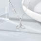 Silver whale-tail necklace with rhinestone pendant centered on chain