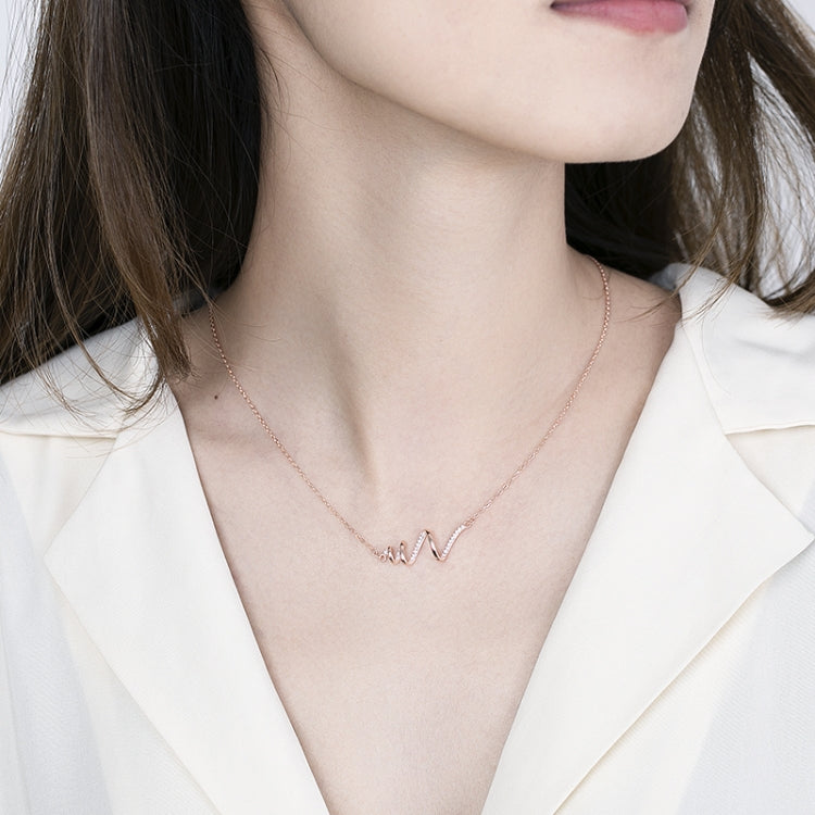 Sterling silver ECG wave necklace on a fine chain worn at the collarbone
