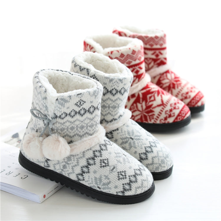 Light gray knit high-top slippers with fuzzy trim, pom-pom accents and black rubber sole
