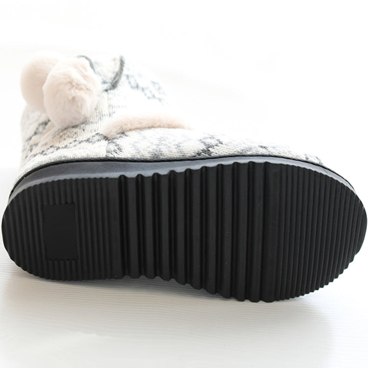 Black ribbed rubber sole of winter high-top knit slippers