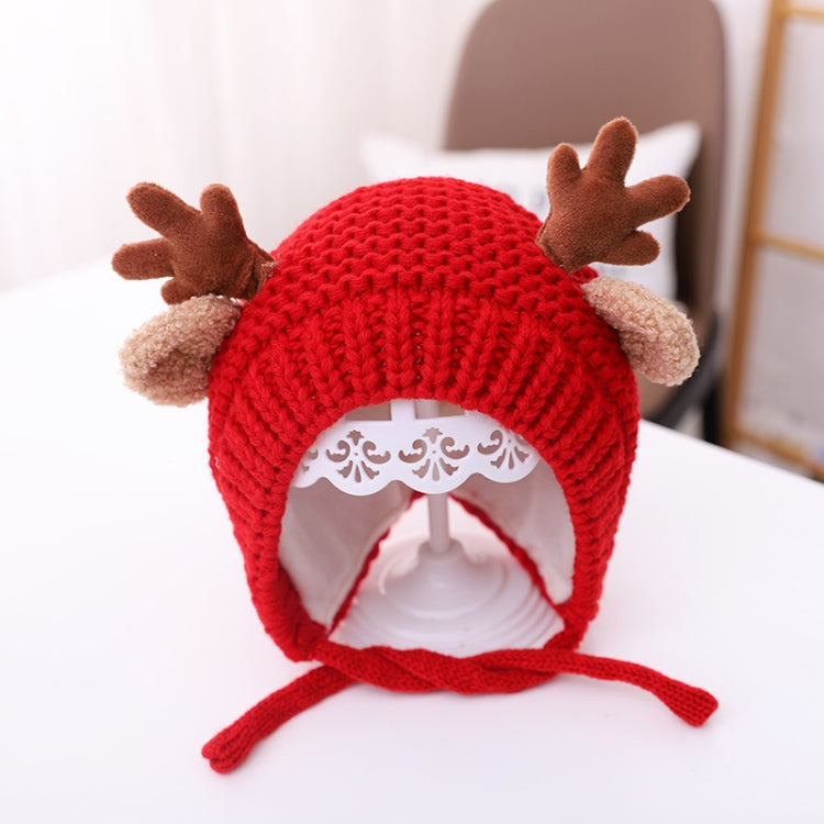 Red baby knitted antler hat with pom-pom ears and tie strings, around 46–48 cm