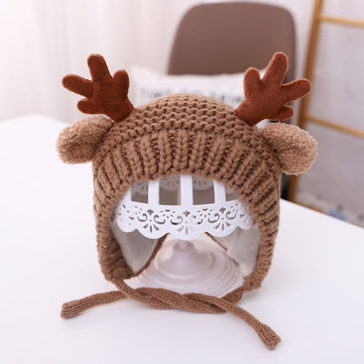 Brown baby knitted antler hat with pom-pom ears and tie strings, around 46–48 cm