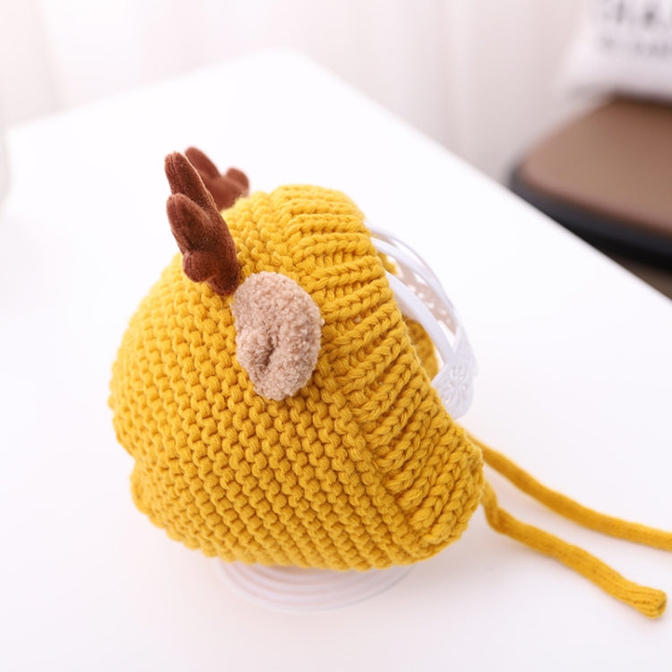 Yellow knit baby antler hat with brown pom-pom detail and side tie strings