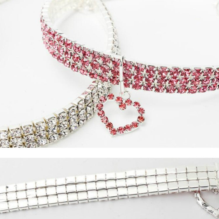 Red rhinestone elastic pet collar with dangling heart charm and front clasp detail