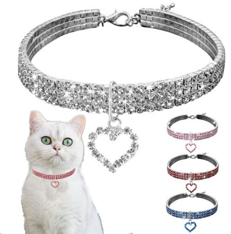 Silver rhinestone elastic pet collar with heart charm and clasp, plus matching collars shown