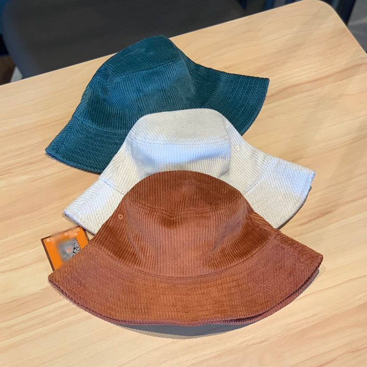 Corduroy fisherman hats in white, teal, and rust brown, foldable bucket styles