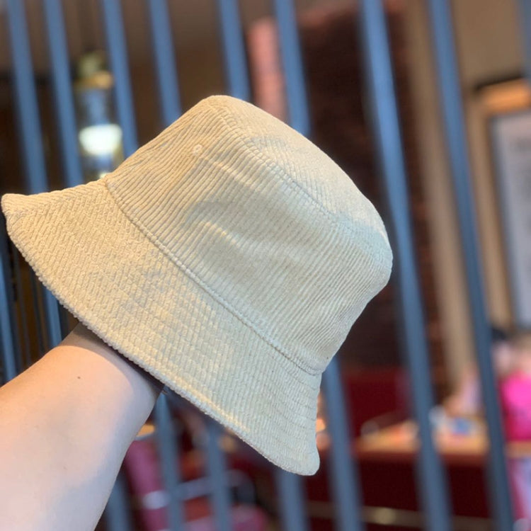 Light tan corduroy fisherman hat with side profile and short brim