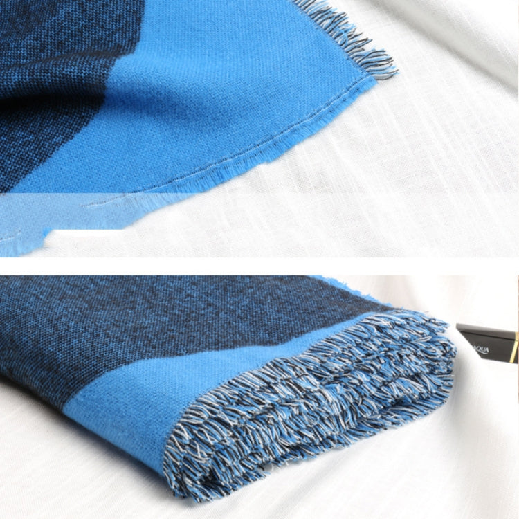 Blue scarf fabric close-up with fringed edge
