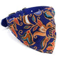 Triangular pet saliva towel bib with adjustable blue strap and detailed cat-head pattern