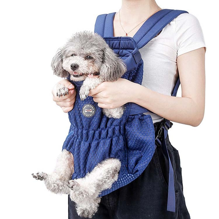 Blue pet chest bag with mesh opening and shoulder straps, carrying a small dog