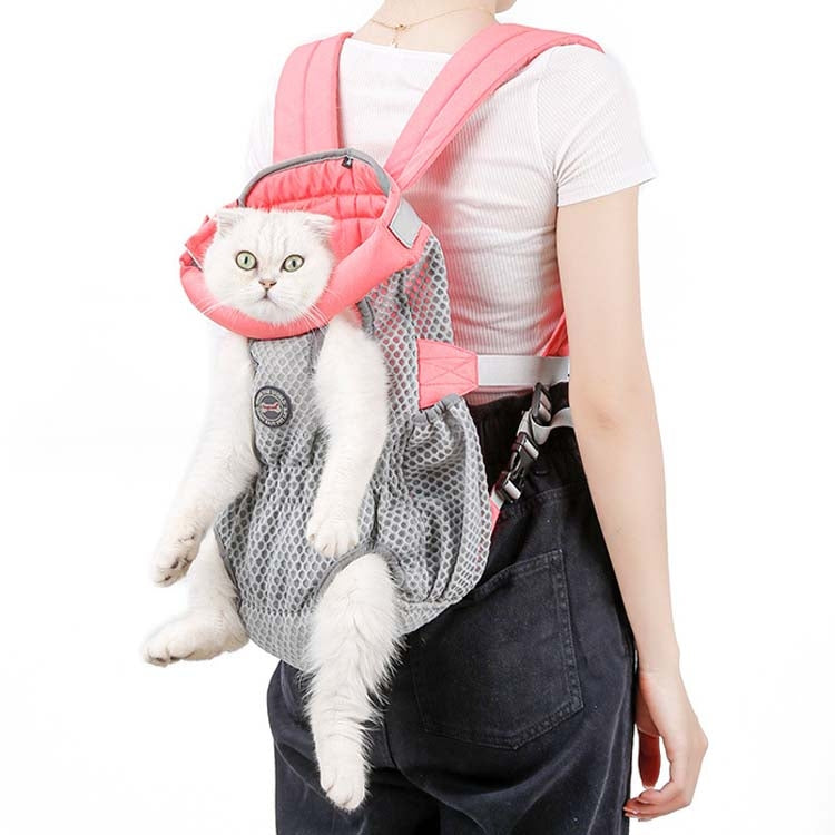 Pink pet chest bag with mesh opening and shoulder straps, carrying a white cat