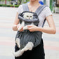 Gray pet chest bag with mesh front and shoulder straps, worn with cat peeking out