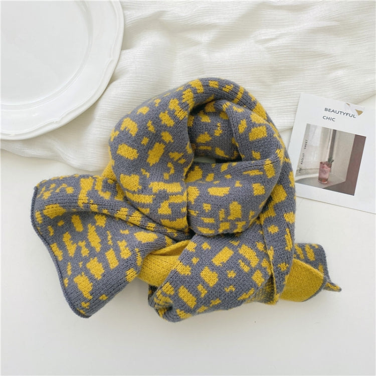 Kids knitted leopard-pattern scarf, yellow and dark gray, folded with bow