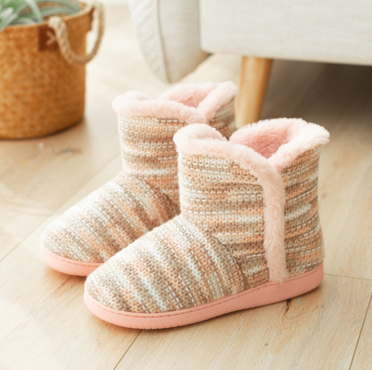 Two beige knit indoor boot slippers with pink fuzzy trim and thick pink rubber sole.