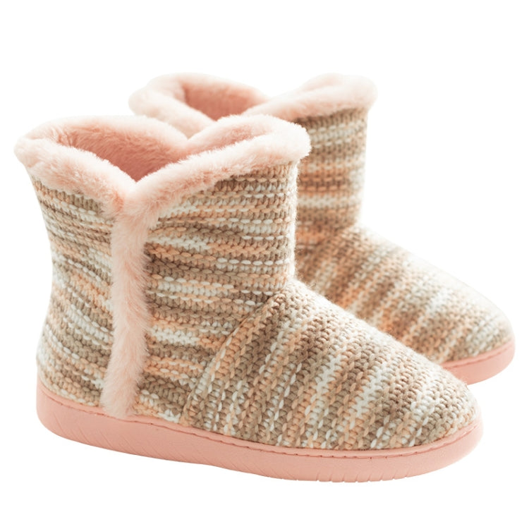 Pair of beige textured knit slippers with pink fuzzy collar and thick pink base sole.