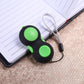 Green and black stress relief hand pad toy with two green buttons and side grip tab.