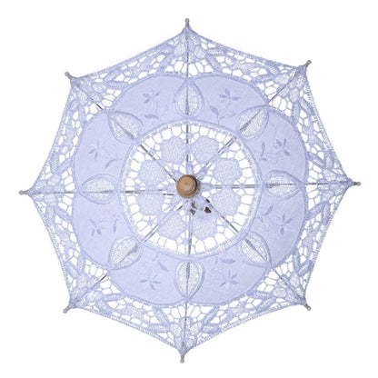 White lace bridal umbrella with floral cutout pattern and wooden center knob