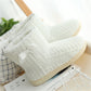White knit slipper boots with front bow detail and thick sole