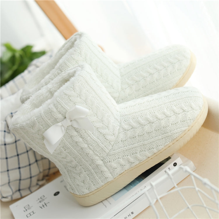 White knit slipper boots with front bow detail and thick sole