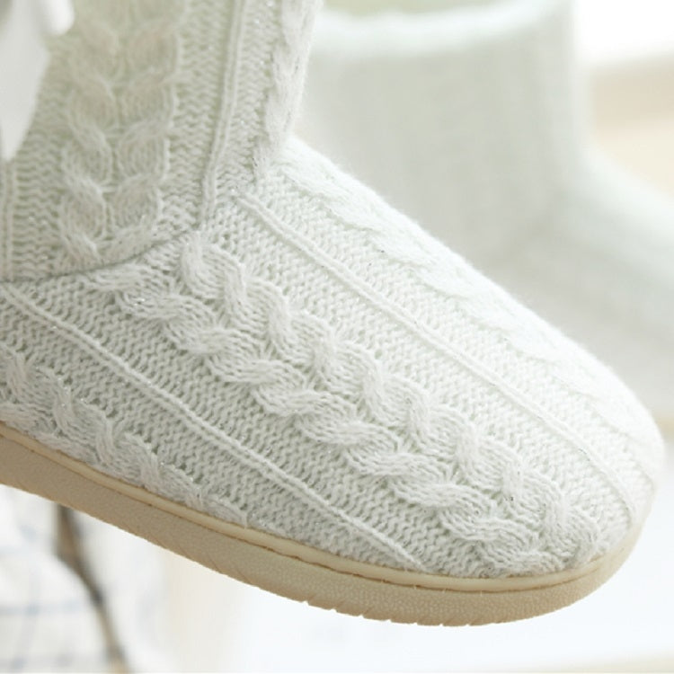 White knit home boot slippers with thick sole and textured cable pattern