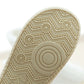 White slipper outsole with circular grip tread pattern and thick sole