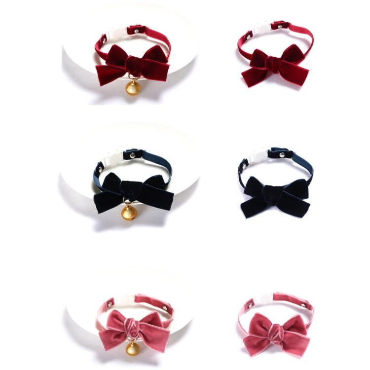 Assorted velvet pet collars with bowknot and bell on adjustable straps.