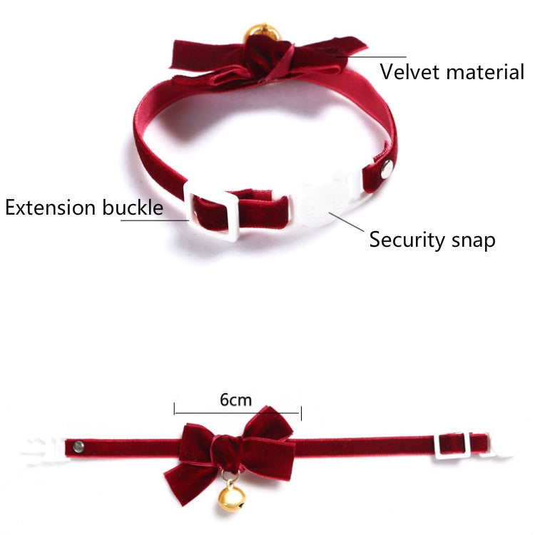 Red velvet adjustable pet collar with bow, snap closure, and gold bell.