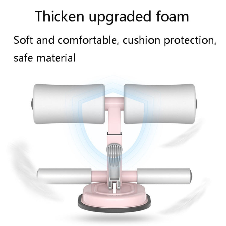 Abdominal crunch assist device with padded white foam rollers and pink support frame