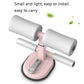 Abdominal crunch assist device with pink base and white foam handles, compact design