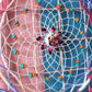 Woven dream catcher hoop close-up with bright beads and a flower-shaped center