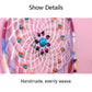 Dream catcher detail: woven mesh with blue flower bead centerpiece and colorful accents