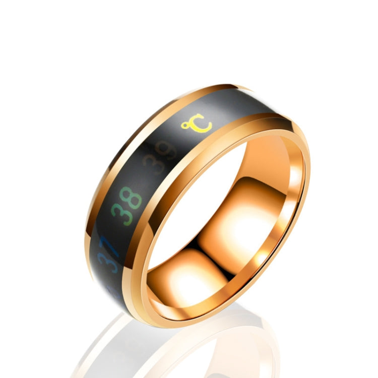 Smart temperature display ring, rose gold angled view with glowing temperature scale on band