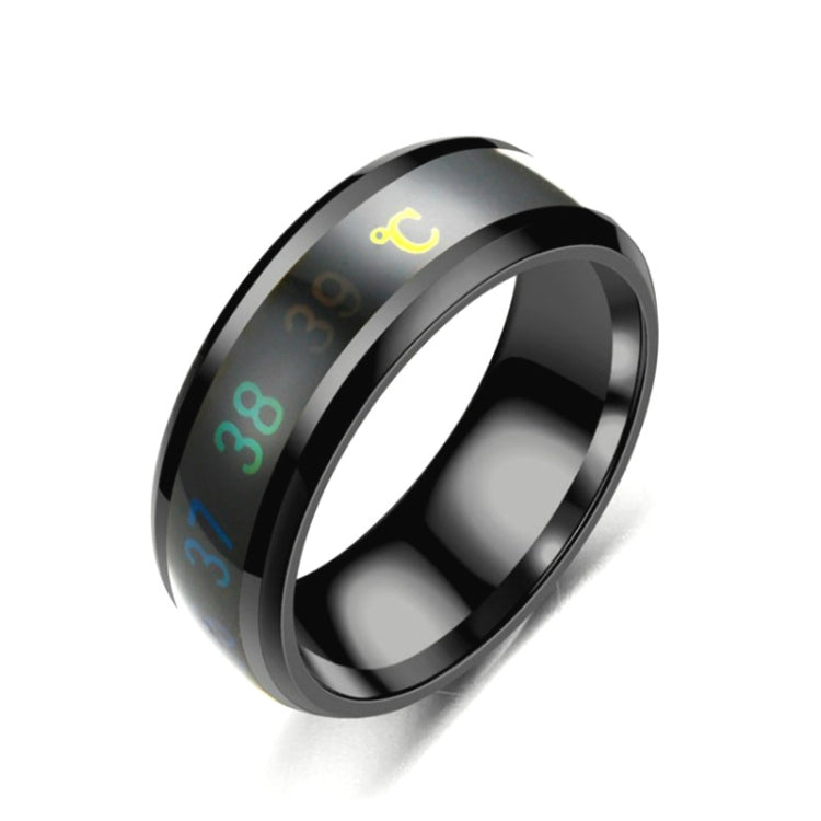Smart temperature display ring, black with glowing temperature scale on dark band