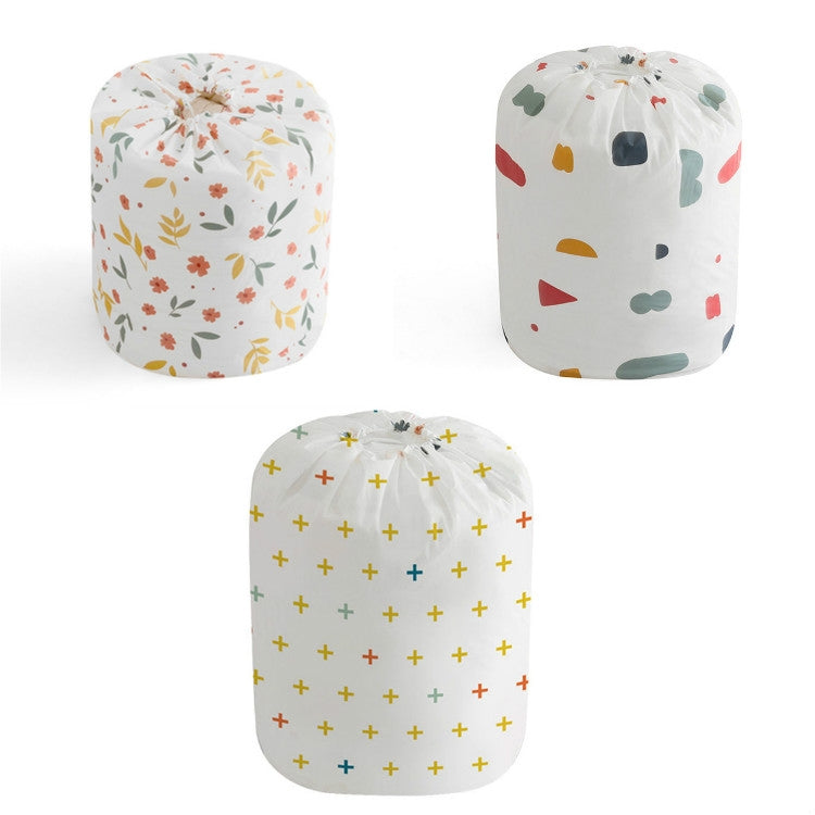 Set of quilt storage bags in floral, geometric, and plus patterns with drawstrings