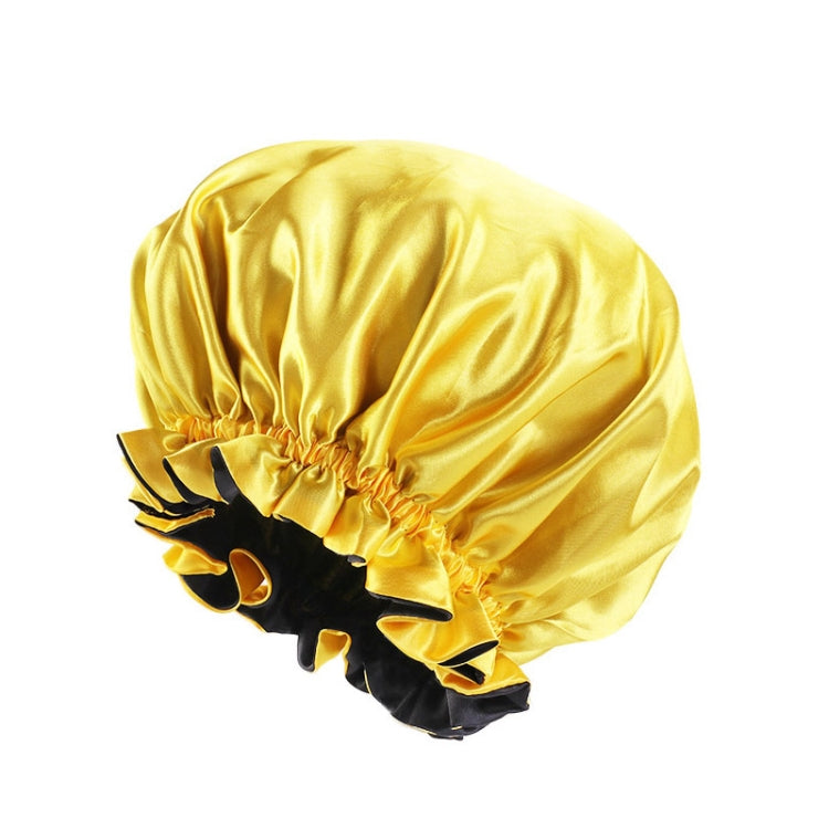 Yellow satin round sleep hat with gathered crown and black ruffle trim edge