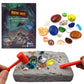 Gem dig excavation toy set with gray rock, colorful gems, and orange digging tools