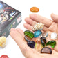 Excavation toy gems in palm, with gray rock and orange-dig tools nearby