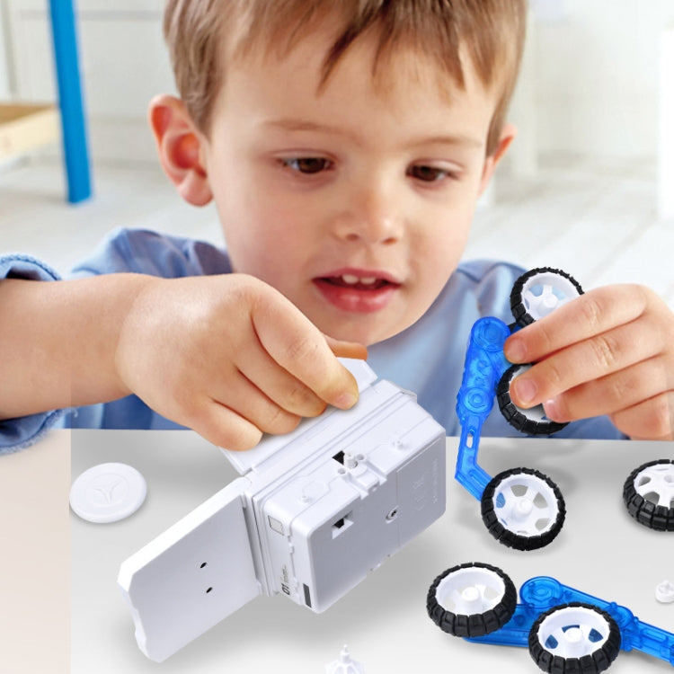 Children playing with a white and blue solar Mars car toy, assembling with wheel pieces.