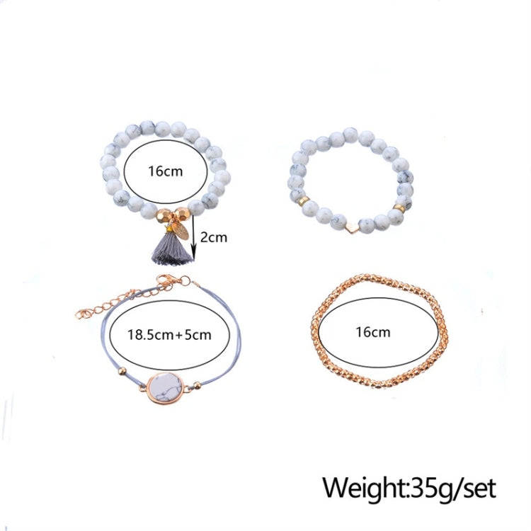 Charm bracelet set featuring round marble-style pendants, tassel, and beaded heart bracelet