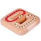 Wooden ball maze toy with interlocking channels and red/white wooden balls