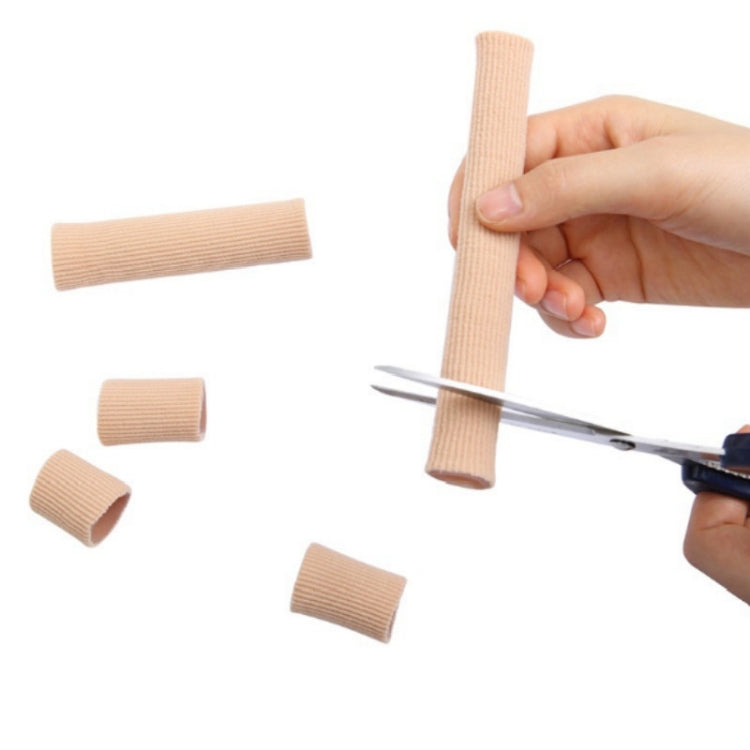 Beige toe separator sleeves, small cut sections shown beside scissors