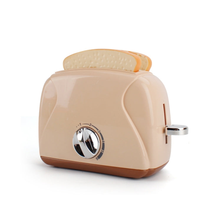 Toy egg steamer with beige base, clear lid, and rotary knob
