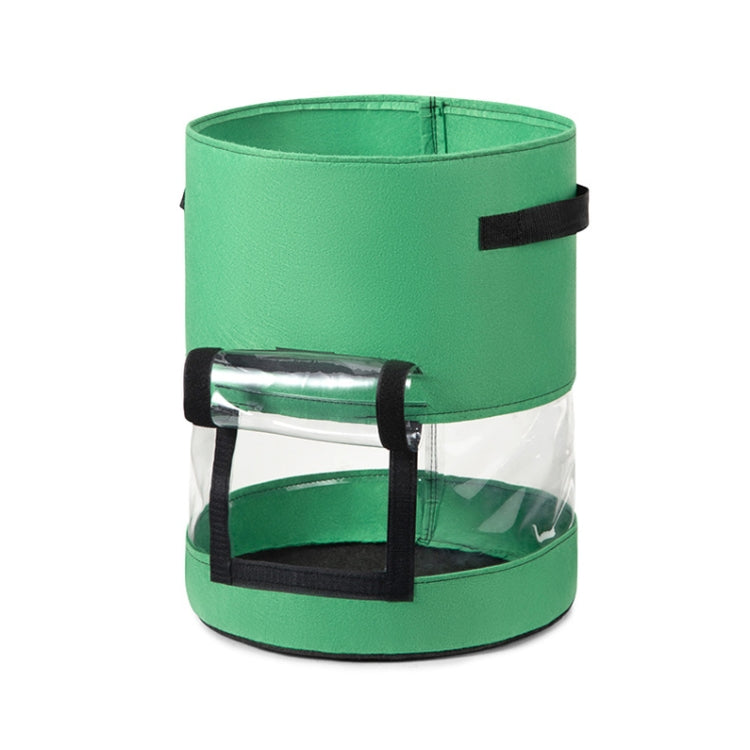 Green transparent potato grow bag with black window panel and reinforced handle straps.