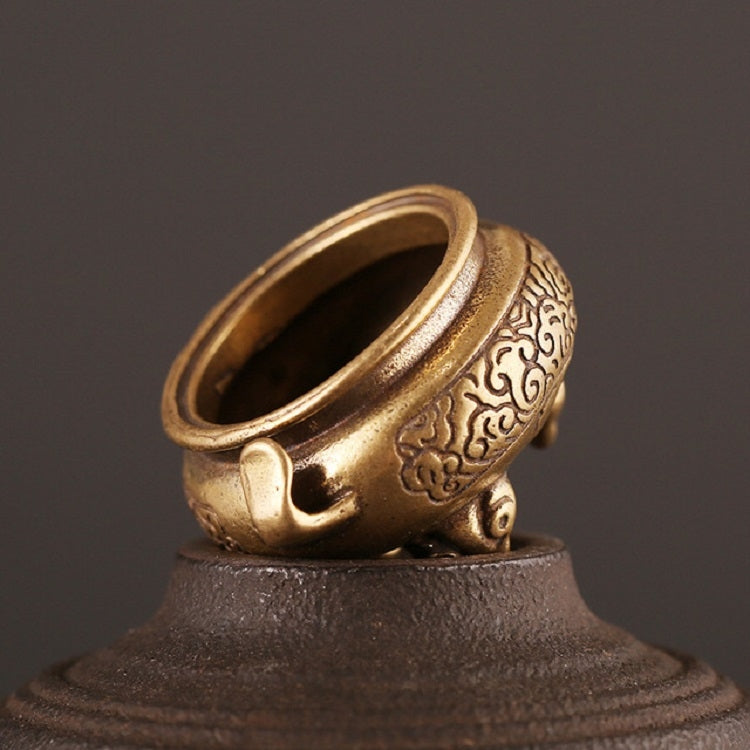 Antique brass censer furnace on pedestal base, side view with open top and scrollwork detail.