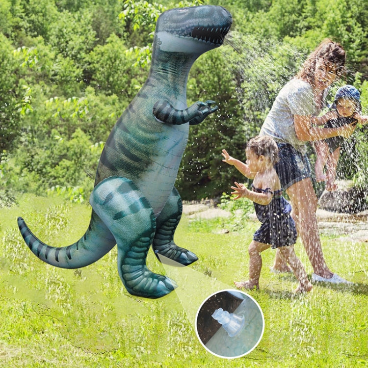 Inflatable green dinosaur water-spray toy spraying water outdoors